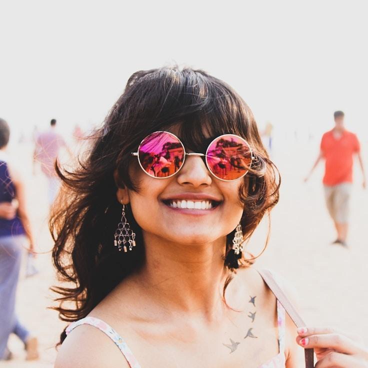 Avery Chen, Lead Design Curator at EmeraldHarborStation, reviewing corporate floral arrangements